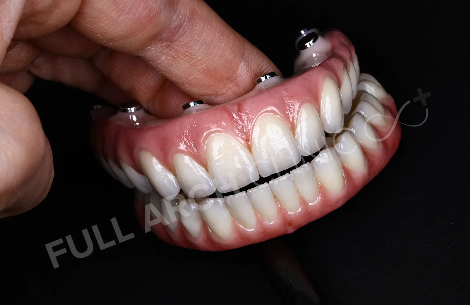Both final arches held by hand in the lab
